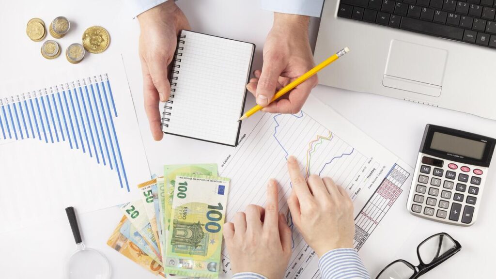 top-view-people-discussing-finances-manners-1-1024x576
